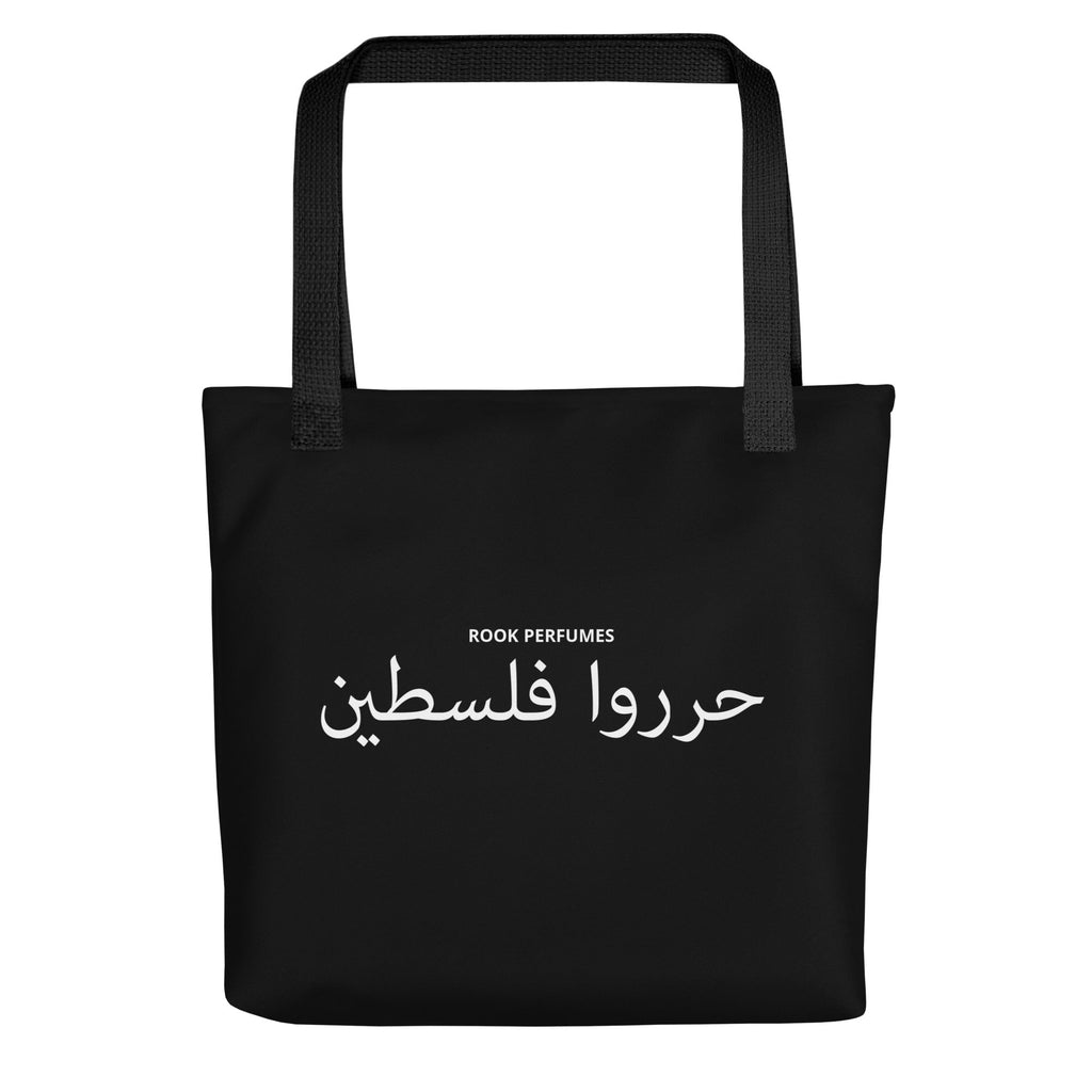 Black tote bag featuring "Filastin Hura" and "Free Palestine" text, with Rook Perfumes branding, designed for unisex use.
