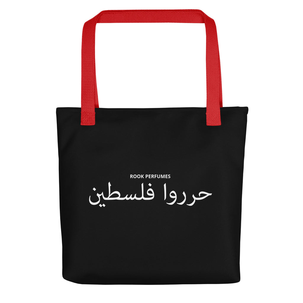 Black tote bag with "Filastin Hura Free Palestine" text by Rook Perfumes, featuring a unisex design and bold message.