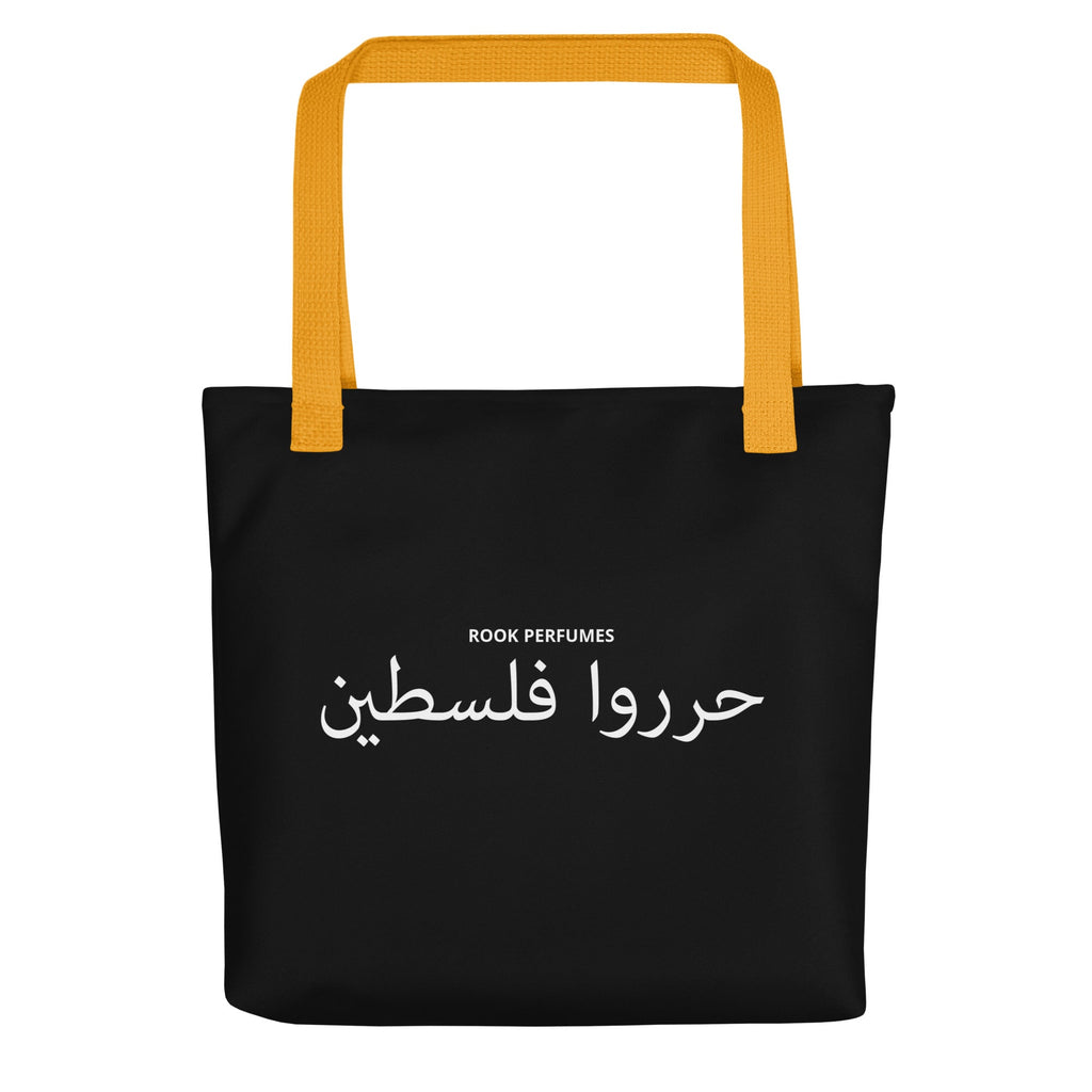 Black tote bag with "Filastin Hura Free Palestine" text, featuring Rook Perfumes branding and a unisex design.