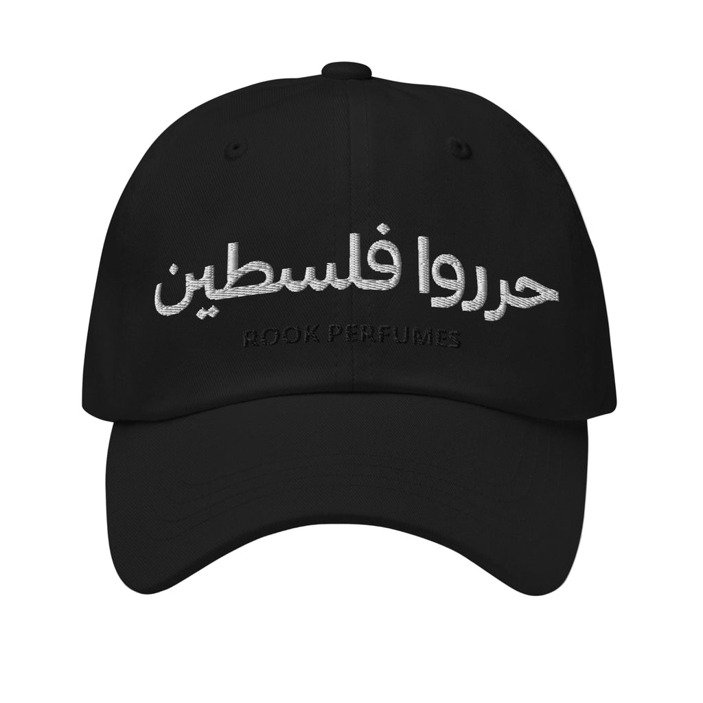 Black cap with "Free Palestine" slogan by Rook Perfumes, featuring bold white text on a black fabric cap.