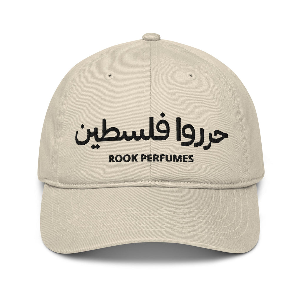 Unisex organic cap with "Free Palestine" slogan, featuring a simple design and Rook Perfumes branding.